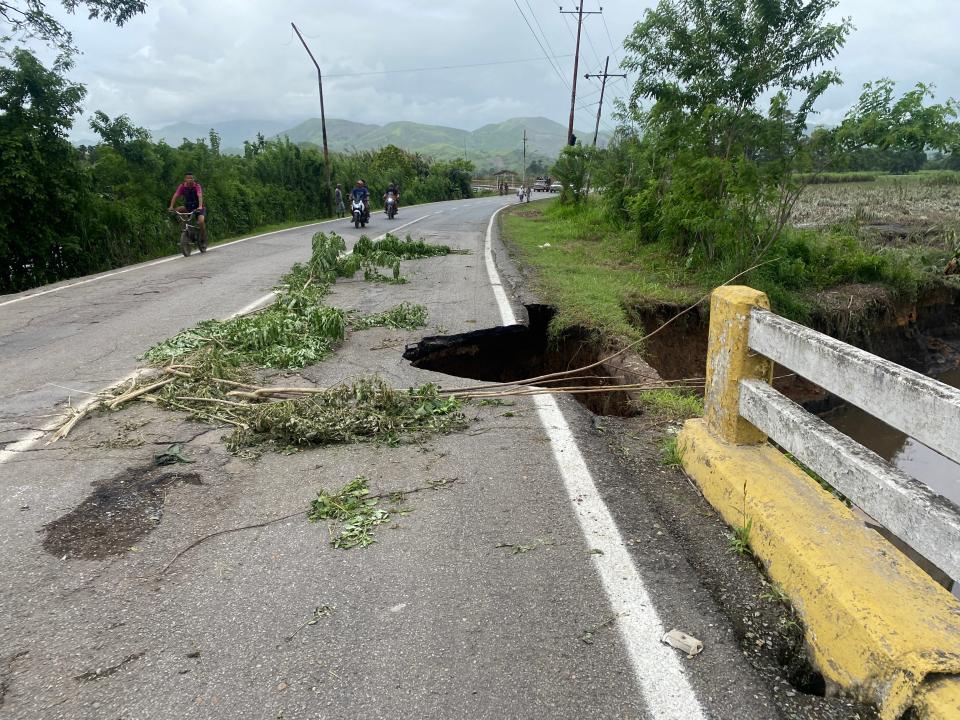 View of a damaged road after a river swelled due to heavy rains following the passage of Hurricane Beryl in Cumanacoa, Sucre State, Venezuela (AFP via Getty Images)